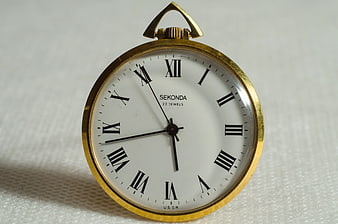 Vintage Sekonda Brass Pocket Watch on White Background