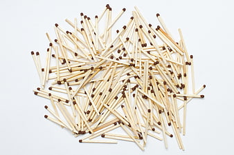 Scattered wooden matches on white background
