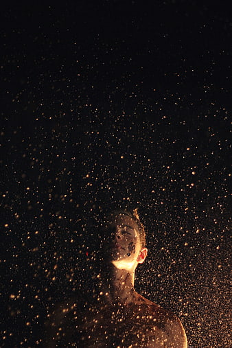 Man in Golden Sand Storm at Night