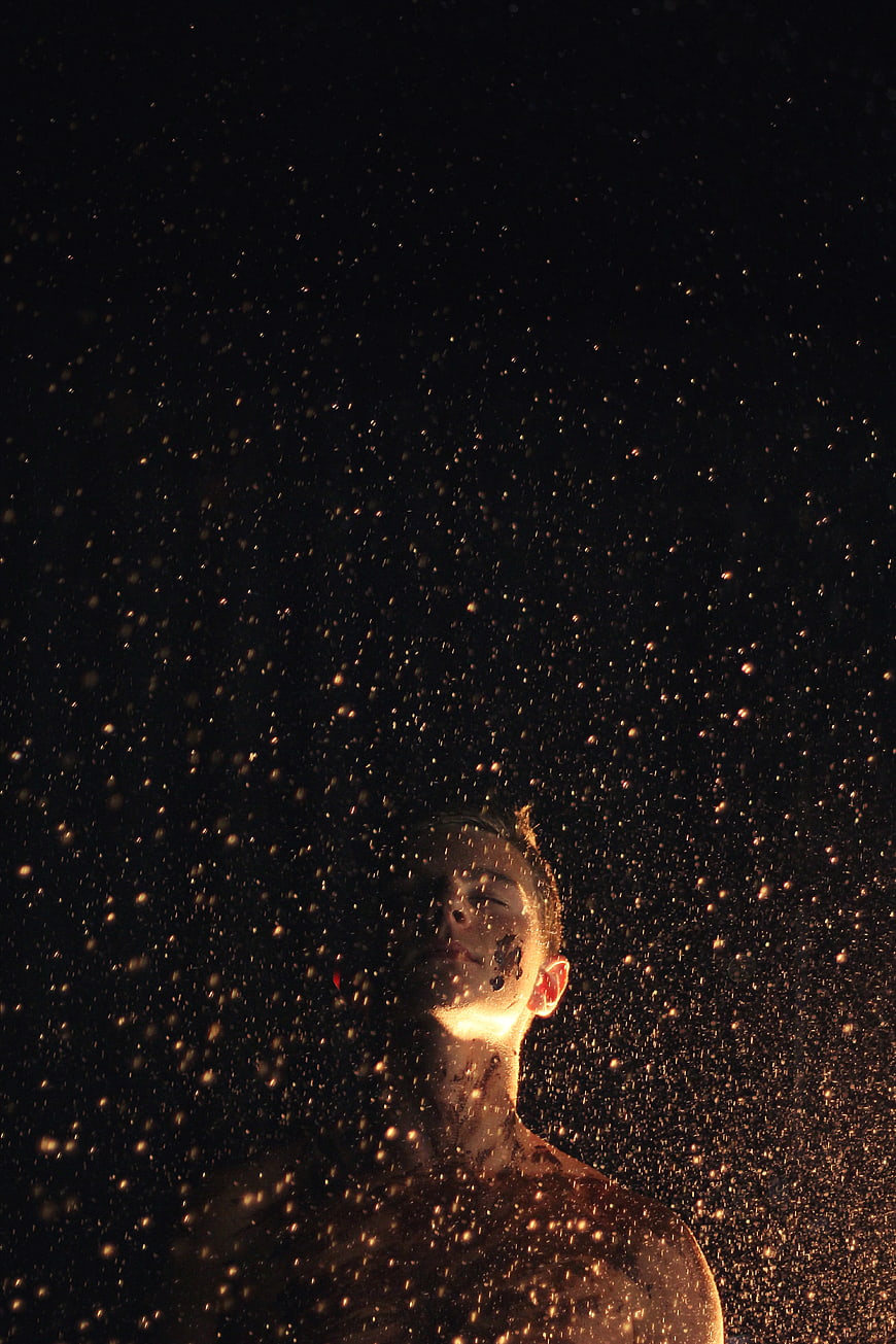 Man in Golden Sand Storm at Night