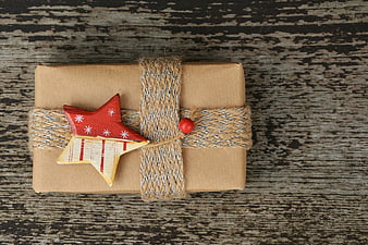 Rustic Christmas Gift Wrapped in Kraft Paper with Wooden Star