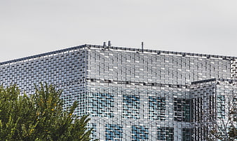 Modern Silver Facade Architecture with Geometric Pattern