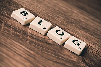 Scrabble Tiles Spelling Blog on Wooden Surface