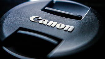 Close-up of black Canon camera lens cap