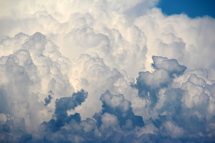 Dramatic Cumulus Clouds Filling Blue Sky
