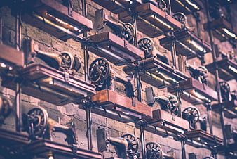 Vintage Sewing Machines on Wooden Shelves in Industrial Workshop