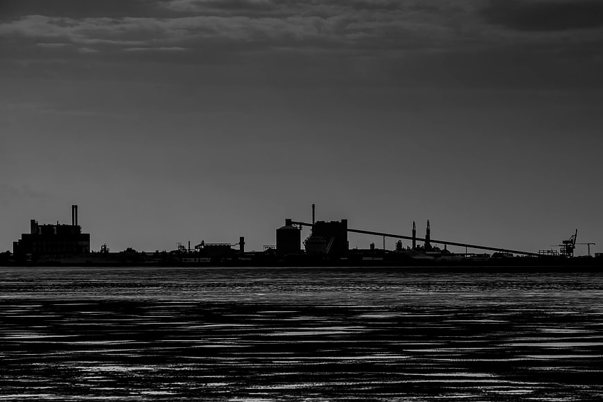 Black and white industrial waterfront silhouette