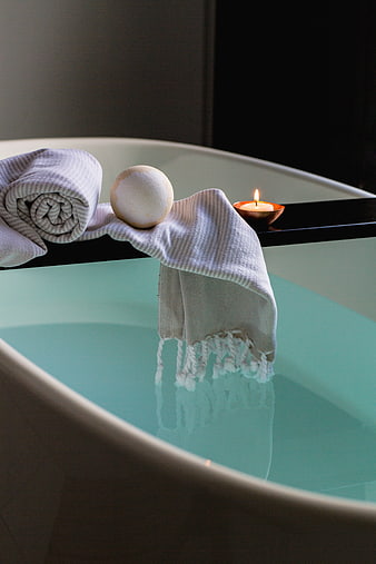 Relaxing Spa Bath with Towel, Bath Bomb, and Candle