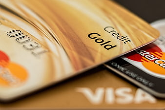 Close-up of Gold Credit Card with Visa and Mastercard