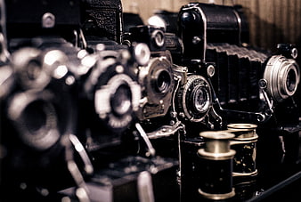 Vintage Cameras and Film Reels on a Shelf