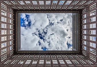 Symmetrical view of Chilehaus architecture looking up at sky