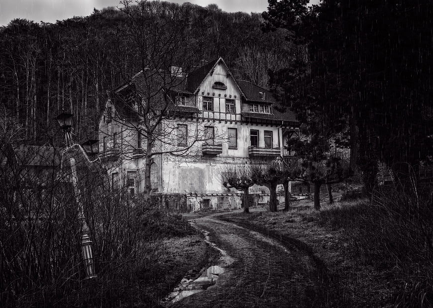Abandoned Villa In Dark Forest With Rainy Path