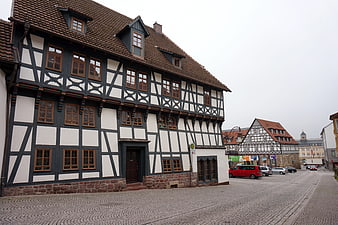Traditional Half-Timbered House on Cobblestone Street in Eisenach, Germany