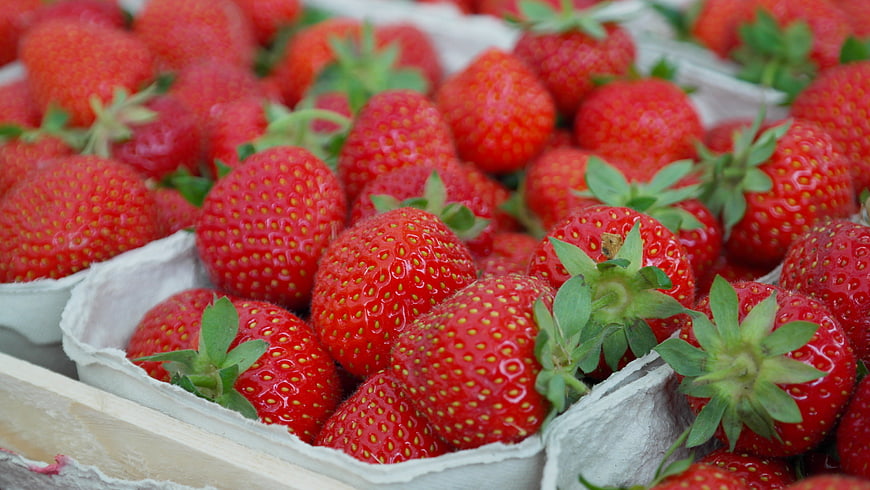Fresh Red Strawberries in White Paper Clamshell Containers