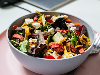 Colorful Fresh Salad Bowl with Cheese and Crisps