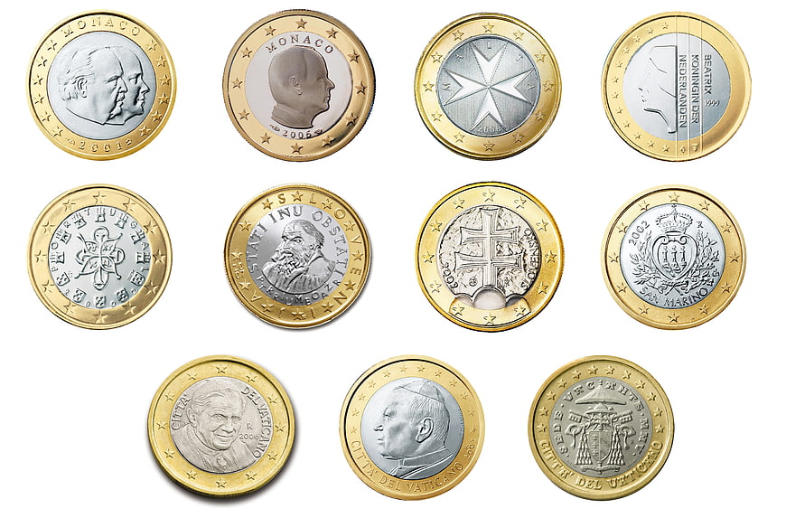 Collection of European 2 Euro Commemorative Coins on White