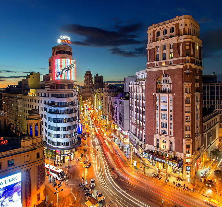 Long exposure night view of Gran Via Madrid traffic and architecture