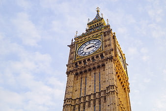 Low angle view of Big Ben clock tower against blue sky