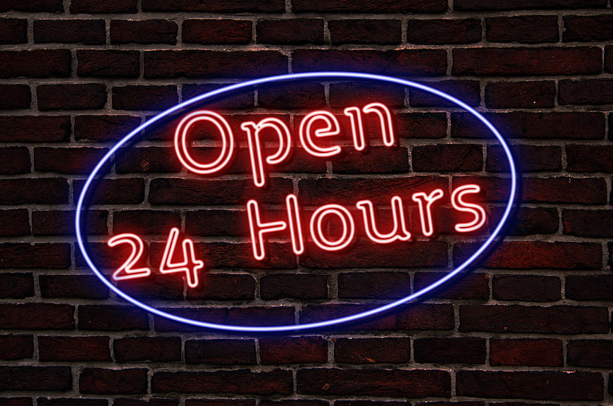 Red and Blue Neon Open 24 Hours Sign on Brick Wall