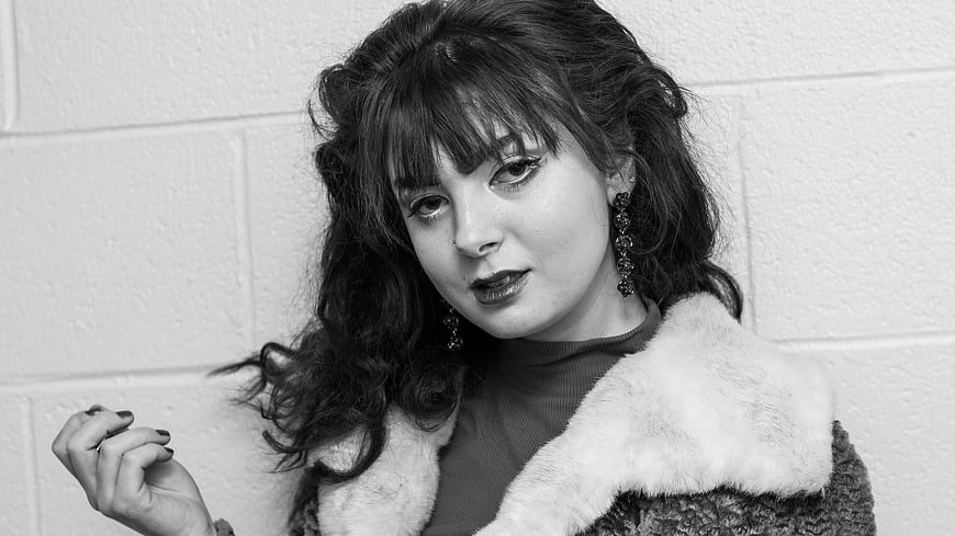 Black and white portrait of woman with fur collar