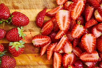 Fresh Sliced Strawberries on Wooden Cutting Board