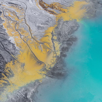 Aerial view of yellow sediment plume in turquoise water