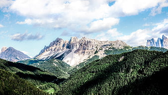 Majestic Dolomites Mountain Landscape with Forest and Clouds