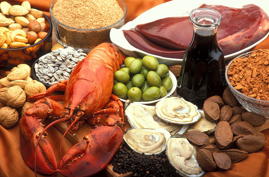 Variety of copper-rich foods including lobster, liver, and nuts