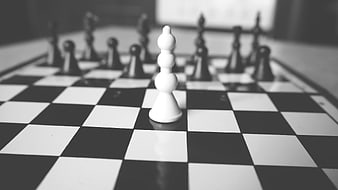 White Chess Pawn on Black and White Board