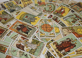 Scattered Tarot Cards Spread Including Wheel of Fortune