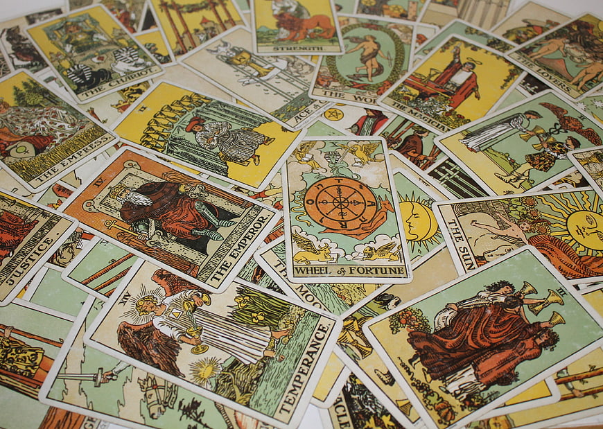 Scattered Tarot Cards Spread Including Wheel of Fortune