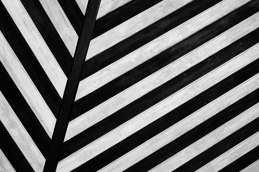 Abstract black and white diagonal wood plank pattern