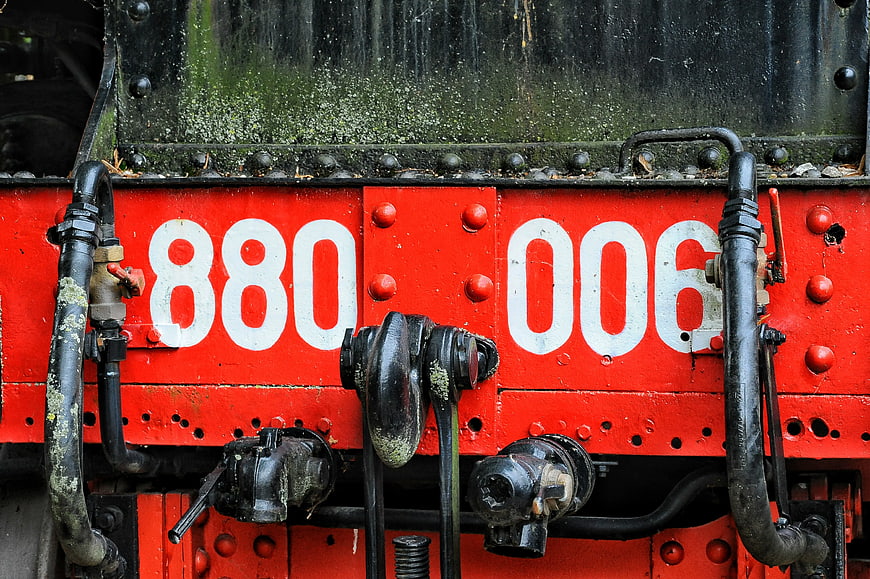 Close-up of vintage red train front with number 880 006