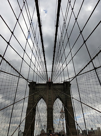 Low angle view of Brooklyn Bridge cables and tower