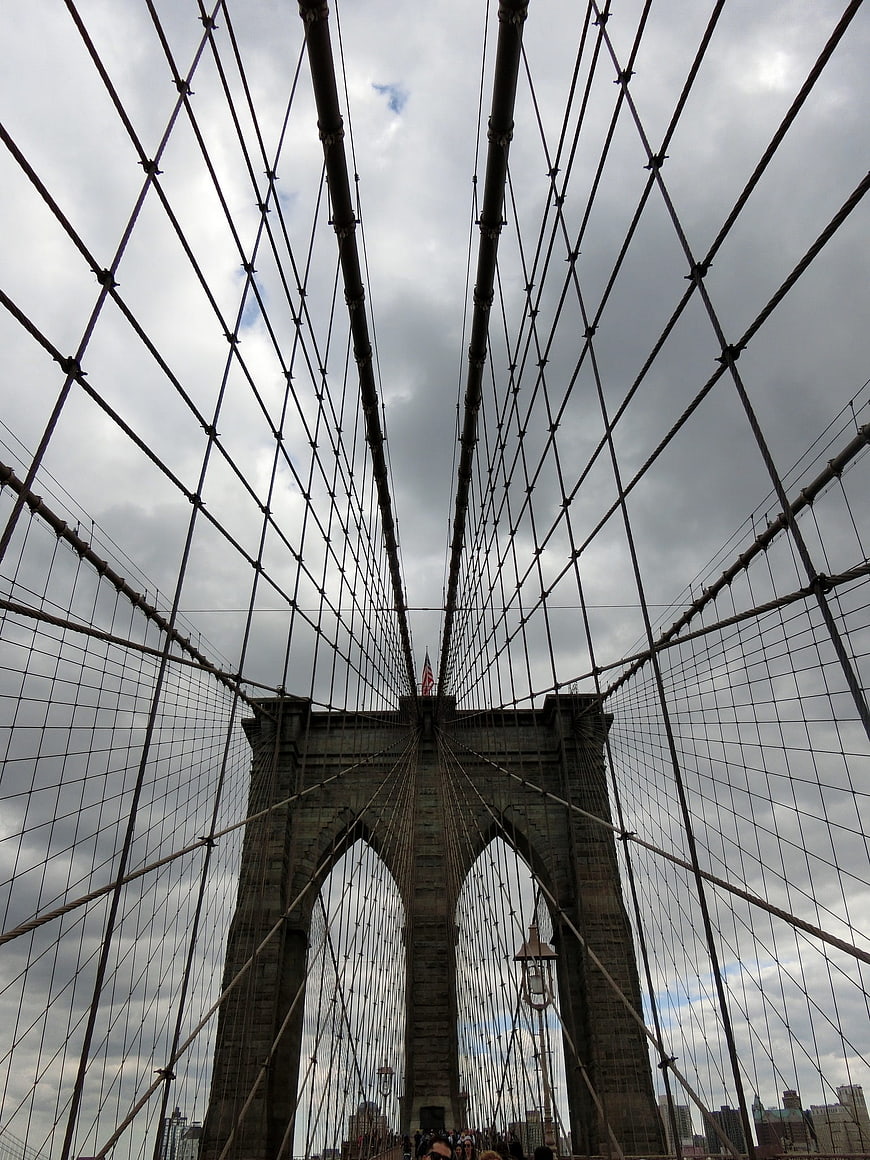 Low angle view of Brooklyn Bridge cables and tower
