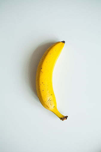 Single Yellow Banana on White Background
