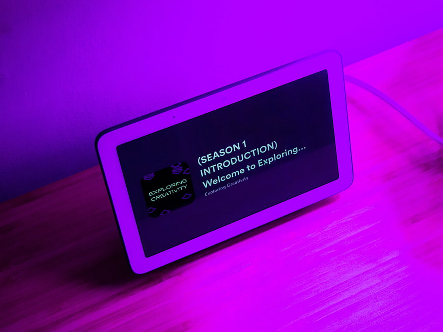 Smart Display Tablet Playing Podcast with Neon Purple Lighting