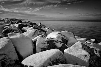 Snow-Covered Rocks Along a Winter Coastline