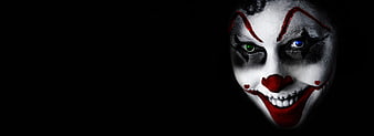 Scary Clown Face with Heterochromia in Dark Background