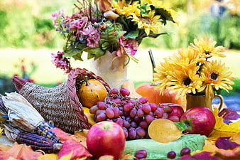 Autumn Harvest Cornucopia with Fruits, Flowers, and Pumpkins