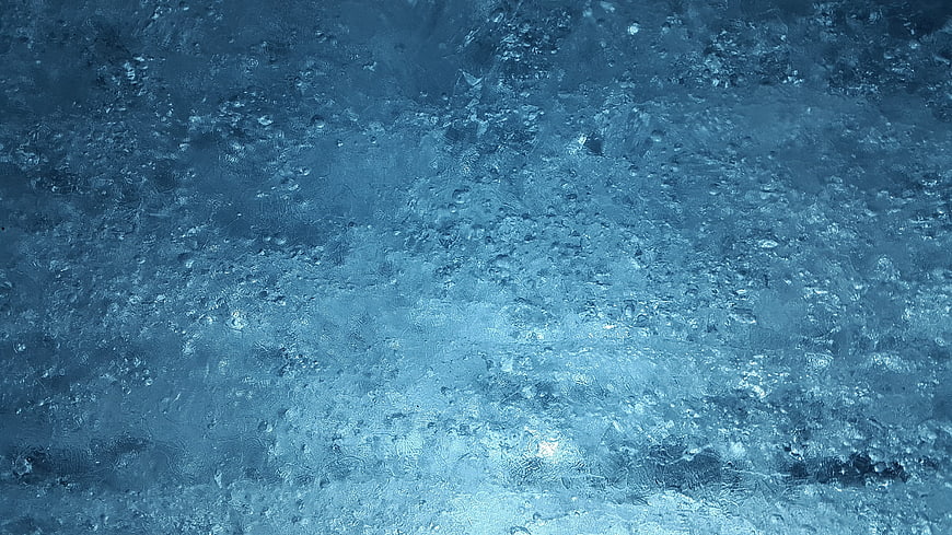 Blue Ice Texture with Air Bubbles and Crystalline Structure