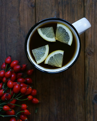 Top View of Tea with Lemon Slices and Rose Hips