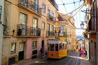 Yellow Tram on Colorful Lisbon Street