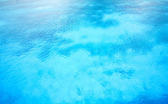 Turquoise tropical ocean water surface texture background