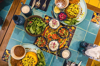 Top View of Traditional Iranian Feast with Rice and Salads