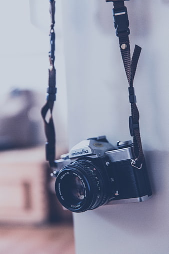 Vintage Minolta Film Camera Hanging on Wall