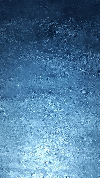 Abstract blue ice texture with frozen bubbles and crystalline structure