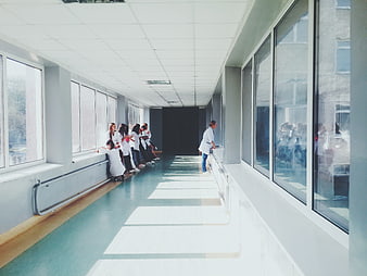 Medical staff resting in a bright hospital corridor