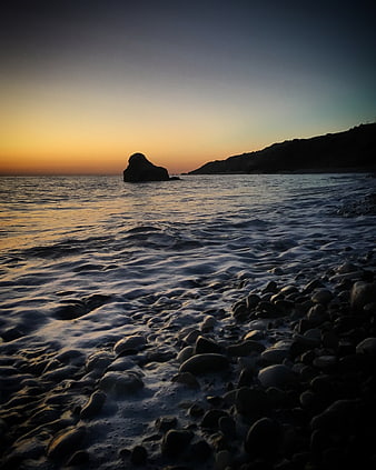 Sunset Seascape with Rocky Shore and Ocean Rock