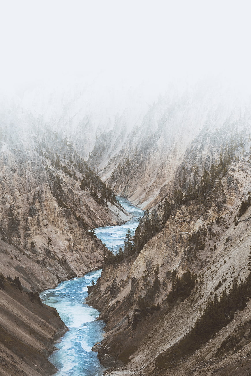Misty Mountain River Canyon Landscape with Blue Water